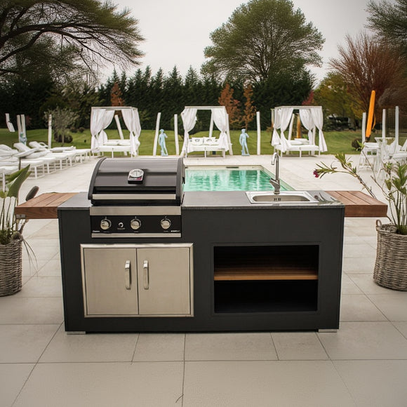 Outdoor kitchen with grill and sink in a garden setting